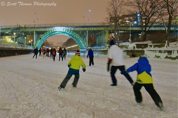 People skating on the Rideau Canal Skateway in Ottawa, Ontario, Canada.